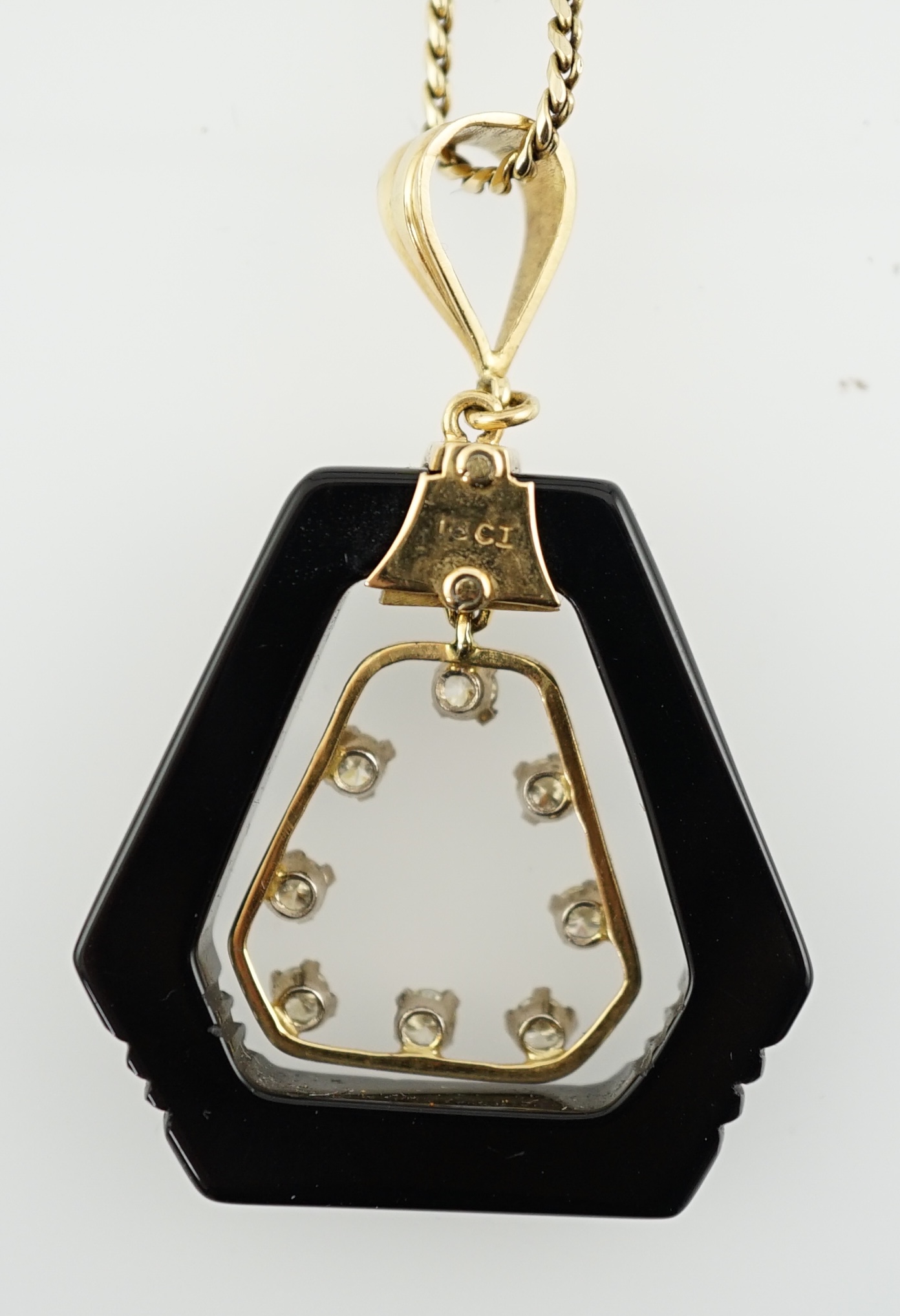 An Art Deco 18ct gold mounted black onyx and diamond set openwork drop pendant